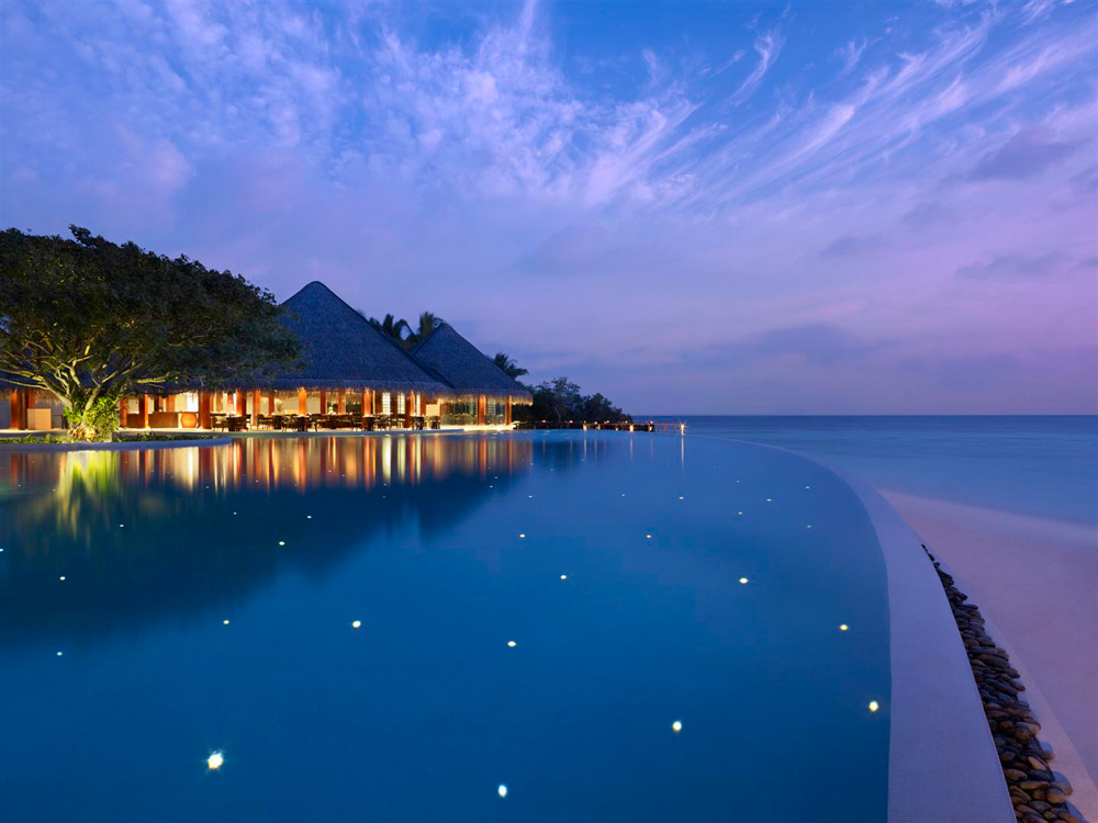 Pool by the Sea during Evening at Dusit Thani Maldives