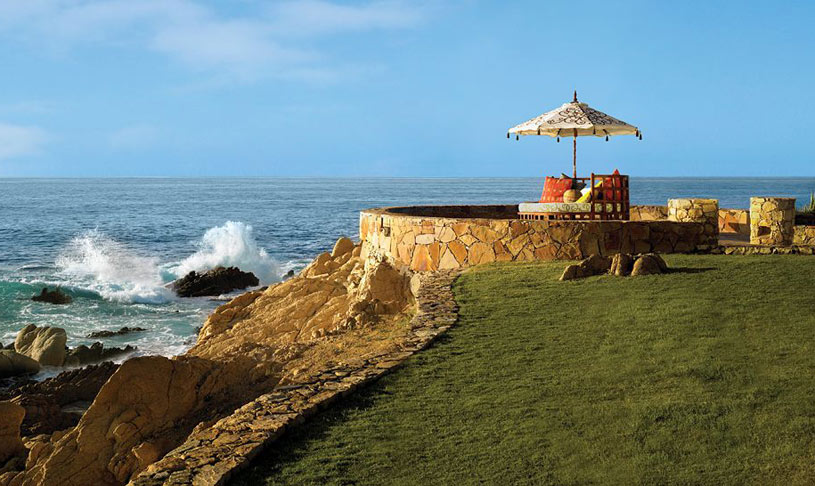 Outdoor seating area along the ocean and One and Only Palmilla Outdoor seating area along the ocean and One and Only Palmilla
