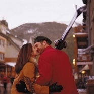 Couple Skiing with Mountain View