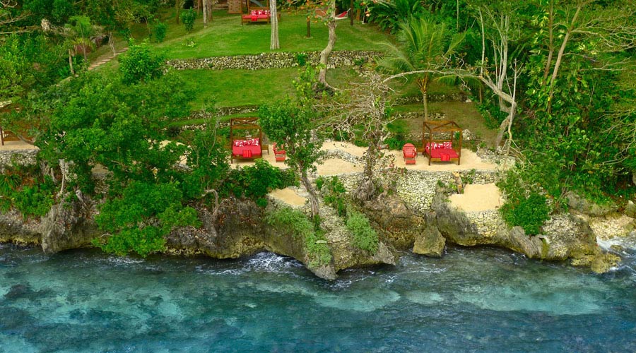 Geejam Beach is located at the foot of the Geejam Hotel in Jamaica. There, you'll discover a natural cove that fits into the shoreline of the Caribbean Ocean with clear water, white sand and an uninterrupted horizon. Here you can swim, snorkel, kayak, paddle board or simply relax on one of the four-poster beds. Molly Hole, a warm water natural spring, and Ital Bath, a skin-cleansing elixir, are both located in secluded places for personal enjoyment and healing for your vacation. Broadband Internet wireless connection is available at Geejam Beach. Geejam Beach is located at the foot of the Geejam Hotel in Jamaica. There, you'll discover a natural cove that fits into the shoreline of the Caribbean Ocean with clear water, white sand and an uninterrupted horizon. Here you can swim, snorkel, kayak, paddle board or simply relax on one of the four-poster beds. Molly Hole, a warm water natural spring, and Ital Bath, a skin-cleansing elixir, are both located in secluded places for personal enjoyment and healing for your vacation. Broadband Internet wireless connection is available at Geejam Beach.