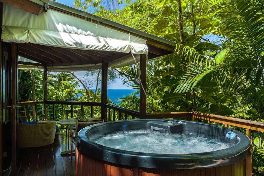 Highlighted by its lush rain forest surrounds, Mento is the ultimate nest for luxurious escape at the Geejam Hotel in Jamaica. This deluxe cabin also features an indoor bathroom with a steam room leading onto a patio, complete with a Jacuzzi and hammock for morning and evening relaxation. Located in a private niche, Mento fuses all the intimacy of a secluded hideaway. The cabin's high ceilings and white linens lend an atmosphere of elegant minimalism, complimented by a sweeping panoramic overlook of forest and sea from the extended veranda. Highlighted by its lush rain forest surrounds, Mento is the ultimate nest for luxurious escape at the Geejam Hotel in Jamaica. This deluxe cabin also features an indoor bathroom with a steam room leading onto a patio, complete with a Jacuzzi and hammock for morning and evening relaxation. Located in a private niche, Mento fuses all the intimacy of a secluded hideaway. The cabin's high ceilings and white linens lend an atmosphere of elegant minimalism, complimented by a sweeping panoramic overlook of forest and sea from the extended veranda.