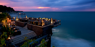 Located on natural rocks 14 meters above the Indian Ocean at the base of AYANA Resort and Spa Balis towering cliffs, this innovative open-top Bali bar is the islands most glam sunset and after-dark destination