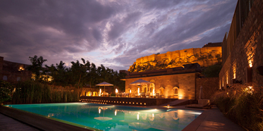 View of the Mehrangarh Fort from the pool area of RAAS Jodphur