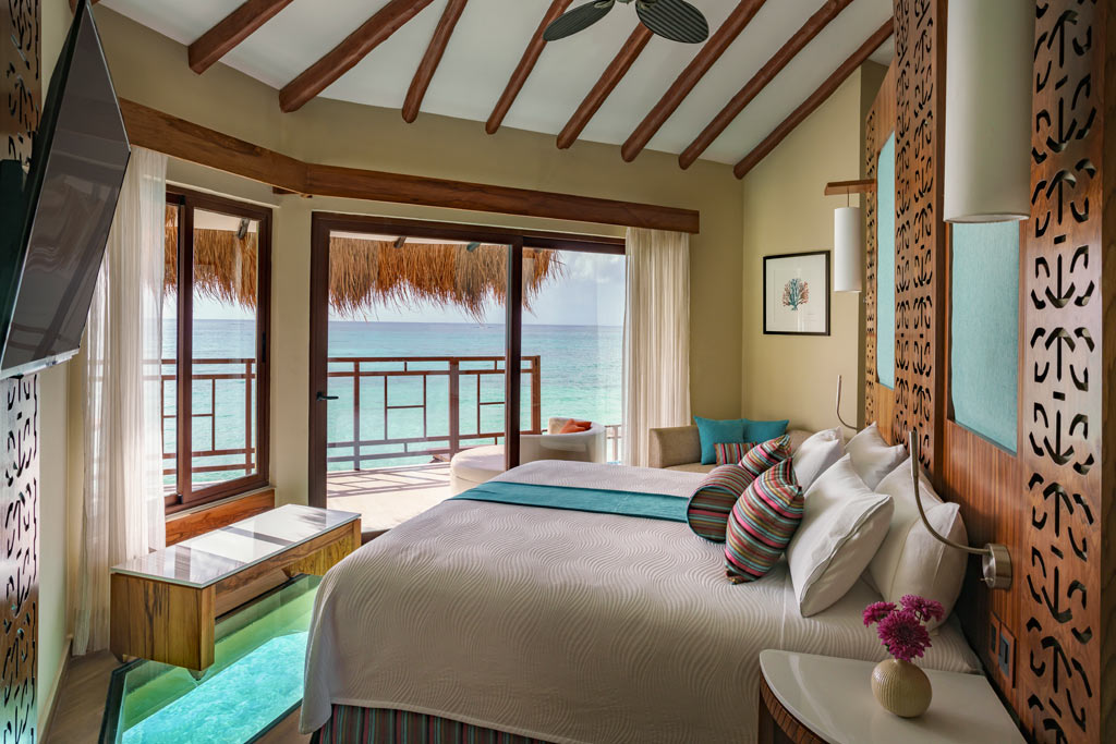 Palafitos Overwater Bungalow Bedroom at El Dorado Maroma