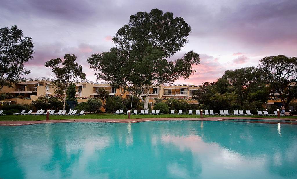 Sunset Over The Outdoor Pool at Sails in the Desert, Yulara, Australia