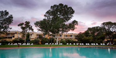 Sunset Over The Outdoor Pool at Sails in the Desert, Yulara, Australia