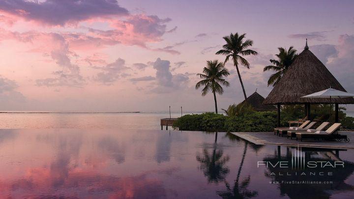 Four Seasons Kuda Huraa Maldives at sunset