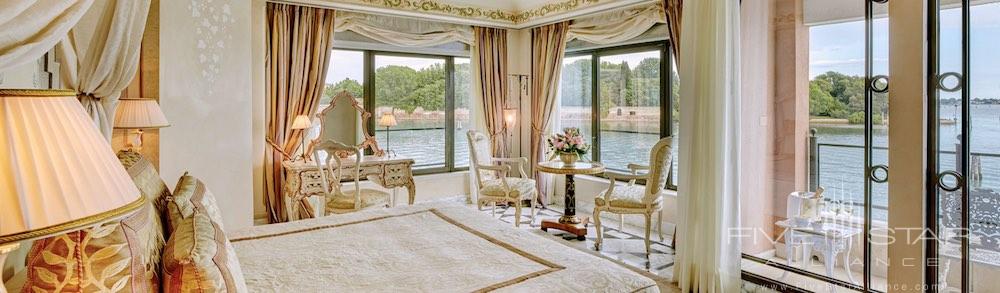 Bedroom with floor to ceiling windows and 180 degree views in the 970 square foot Palladio Signature Suite at the Belmond Cipriani Hotel in Venice, Italy