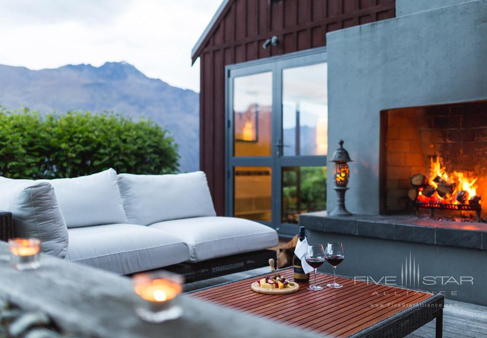 Have cheese and wine by an outdoor fire at Azur Lodge, Queenstown
