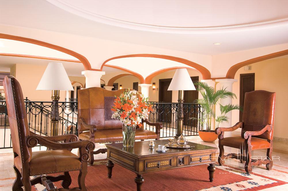 Leather chairs and mahogany furnishings at Secrets Capri Riviera Cancun in Playa del Carmen, Mexico