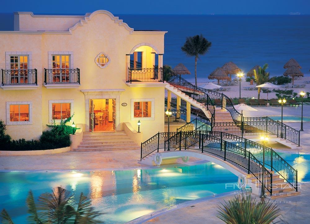 Night time view of the pool at Secrets Capri Riviera Cancun in Playa del Carmen, Mexico