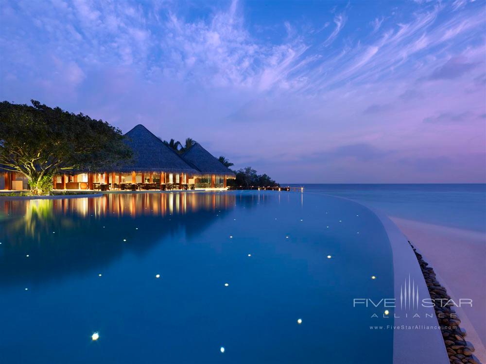 Pool by the Sea during Evening at Dusit Thani Maldives