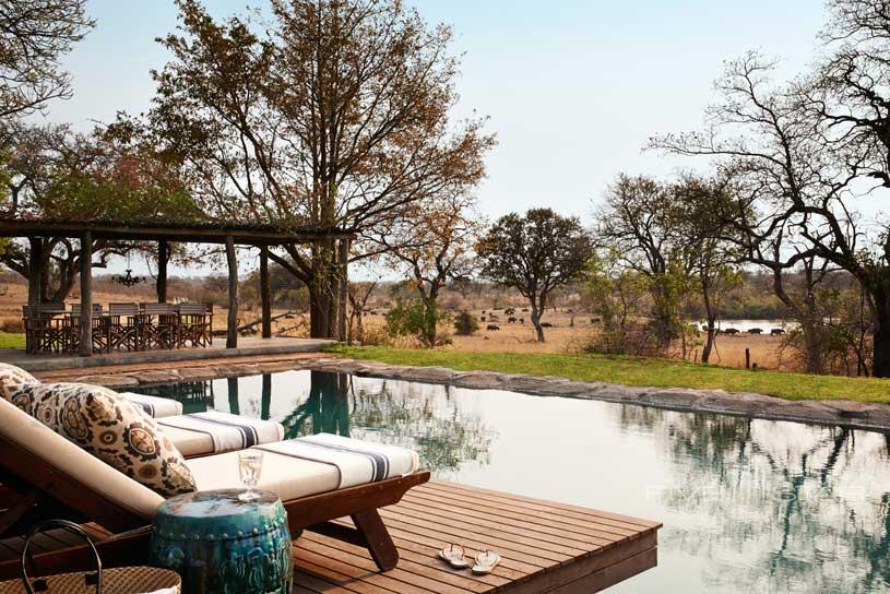 Outdoor Lounge and private pool at Singita Boulders Lodge overlooking the 45 000 acre game reserve in the Sabi Sand Reserve adjacent to the Kruger National Park