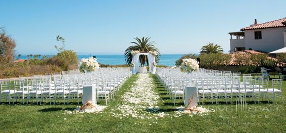 The Ocean Lawn at Bacara Resort &amp; Spa affords panoramic ocean views for a wedding ceremony and is surrounded by the resorts lush landscaping.