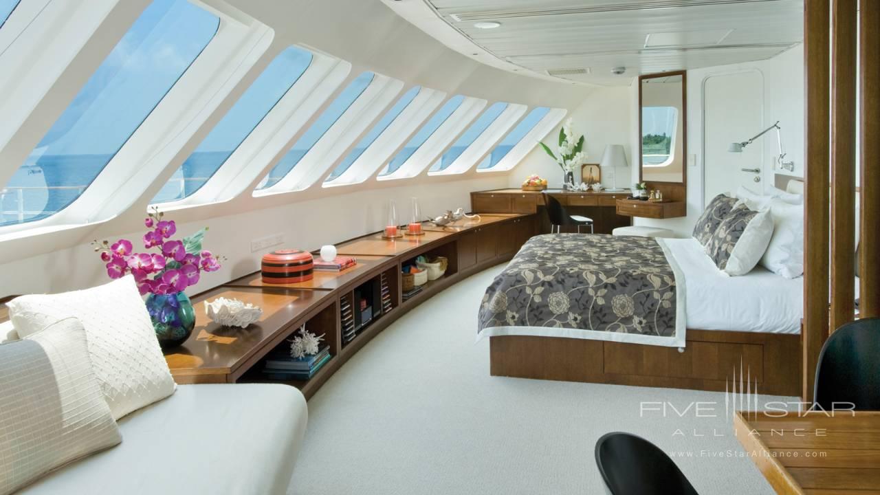 Suite onboard the Four Seasons Explorer catamaran yacht in the Maldives