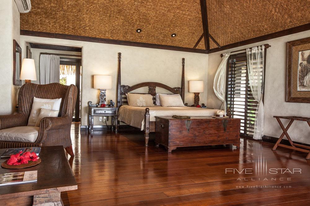 Ultimate Beachfront Bungalow bedroom at Pacific Resort Aitutaki