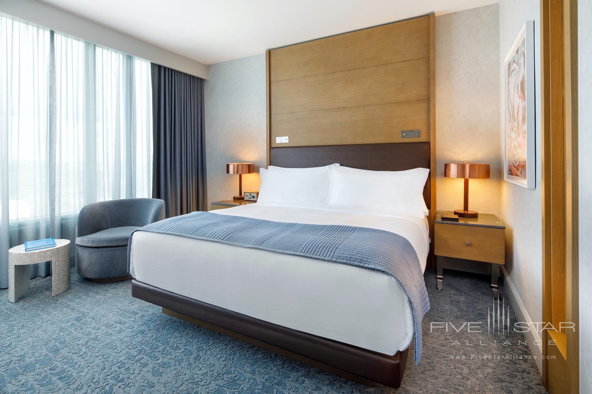 Guest rooms at The Joseph Hotel in Nashville offer inviting beds, Frette linens, and elegant touches of oak, copper, leather, and marble throughout.