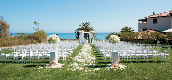 The Ocean Lawn at Bacara Resort & Spa affords panoramic ocean views for a wedding ceremony and is surrounded by the resort's lush landscaping.